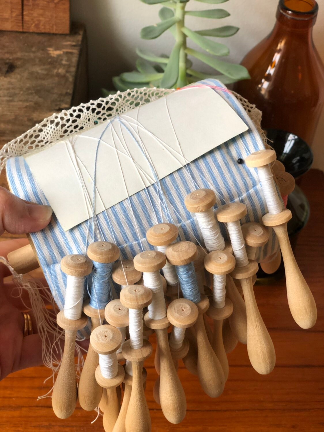 Lace making pillow wheel with lace pattern and lace / hand turned wooden bobbles Scandinavian