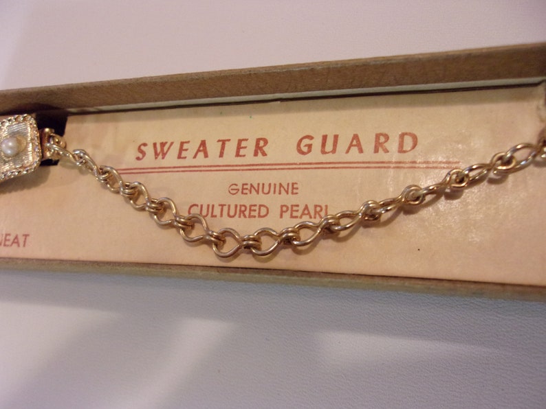 sweater guard clips,genuine cultured pearls,vintage,original packaging,gold tone finish,chain and clips,brushed satin finish,accessories