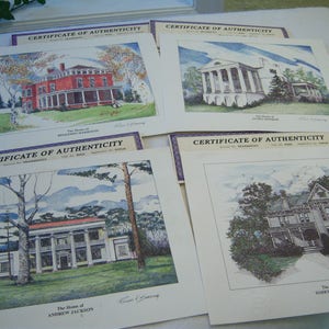 May include: A collection of watercolor prints depicting historic homes, including the homes of Benjamin Harrison, James K. Polk, Andrew Jackson, and Harry S. Truman. Each print is accompanied by a certificate of authenticity.