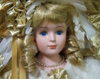 23" tall porcelain doll,vintage porcelain doll,cream & gold metallic dress,blonde curls,blue eyes,Victorian Collection Gallery,made in USA