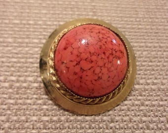 gold tone brooch,coral color stone,round brooch,vintage brooch,classic design,well made,rope design,vintage jewelry,unique,textured stone