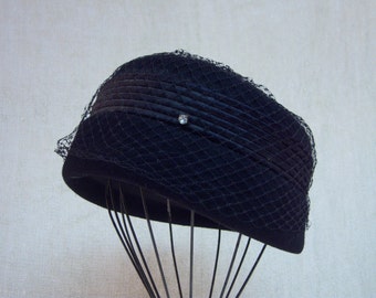 vintage hat,pill box hat,Henry Pollak,black wool,black netting,satin trim,rhinestones,union made tag,size Medium,vintage accessories,formal