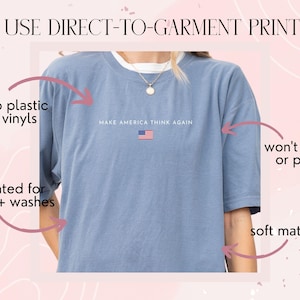 May include: A light blue t-shirt with the text "MAKE AMERICA THINK AGAIN" and a small American flag. The shirt is made of soft material and is rated for 75+ washes. The printing uses no plastic vinyls and won't crack or peel.