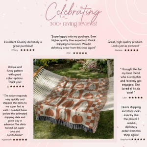 May include: A woven throw blanket with a Halloween theme, featuring a pattern of pumpkins and ghosts in shades of brown, cream, and white. The blanket is draped over a hammock, with fringed edges.