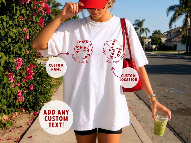 May include: White t-shirt with red dice graphic and text. The dice have heart-shaped pips. Text includes "Kaitlyn's Back" and "Las Vegas 2023". The shirt also has prompts for custom name, location, and text.