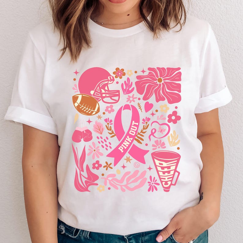 May include: White t-shirt with a pink ribbon, football helmet, and other pink and gold designs. The text "PINK OUT" is written on the ribbon.