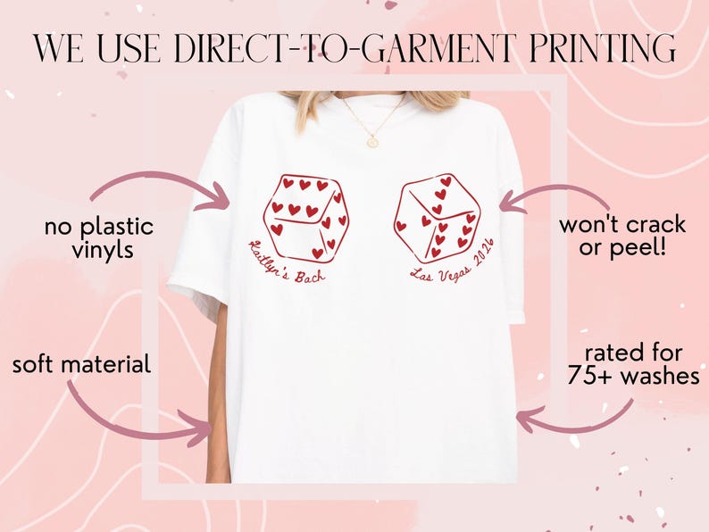 May include: White t-shirt featuring two dice with red heart details. The text "Kaitlyn's Bach Las Vegas 2026" is printed on the shirt. The image also includes text that says "WE USE DIRECT-TO-GARMENT PRINTING", "no plastic vinyls", "soft material", "won't crack or peel!", and "rated for 75+ washes".