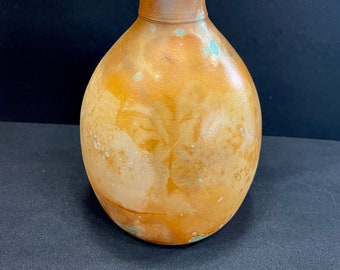 Wheel thrown pit fired bottle