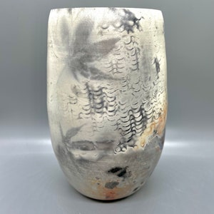 Wheel thrown decorative pit fired vase