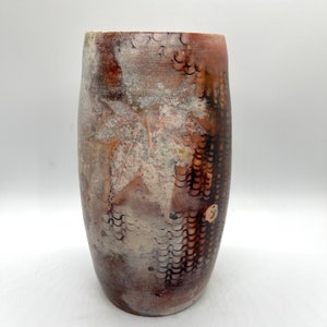 Wheel thrown decorative pit fired vase with leaf impressions