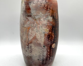 Wheel thrown decorative pit fired vase with leaf impressions