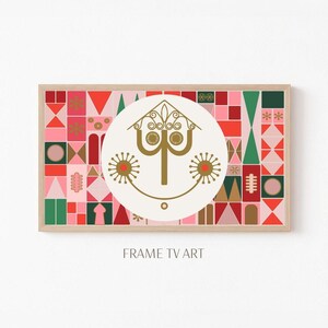May include: A framed print with a pink, red, and green geometric pattern. The center of the print features a white circle with a gold stylized tree inside. The tree has a smiling face with two red circles for eyes. The text "FRAME TV ART" is printed below the frame.