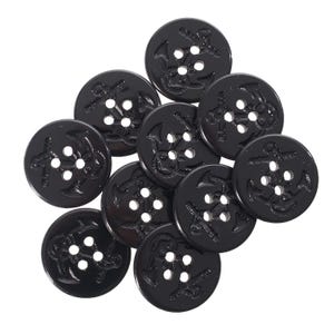 May include: A collection of glossy black buttons featuring an anchor design. Each button is round with four holes for sewing. The anchor design is raised, adding a nautical theme. Suitable for various sewing projects.