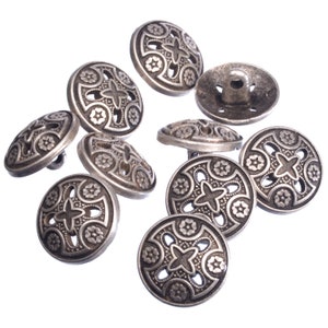 May include: A set of ten silver-toned buttons with an intricate floral design. The buttons have a raised centre and a smooth, polished finish.