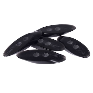 May include: Five black plastic buttons with two holes each. The buttons are oval shaped and have a marbled pattern.