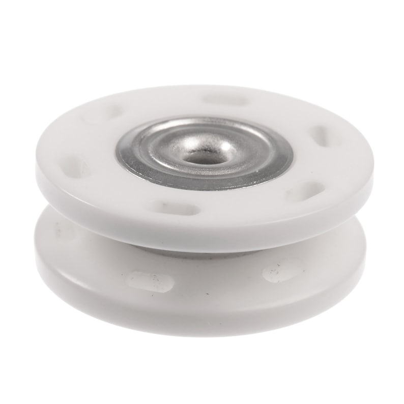 May include: White plastic button with a silver metal center. The button has a raised lip around the edge and a smooth surface.