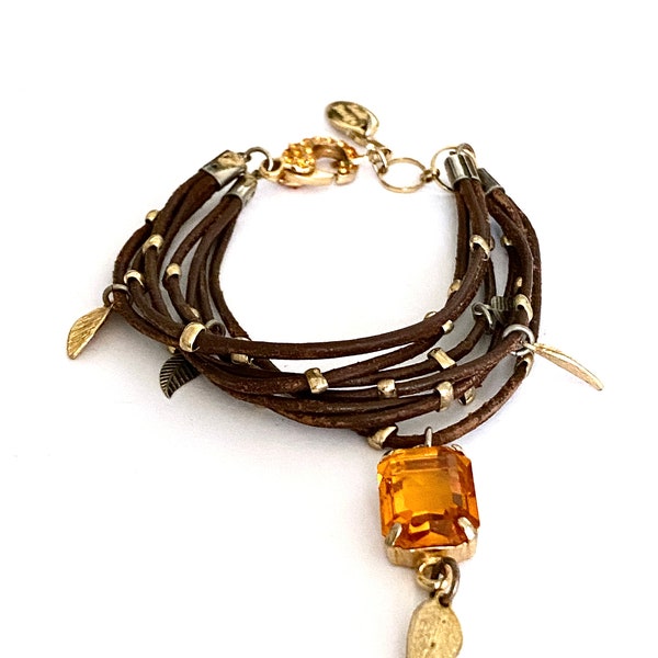 Unique "Sade Design" Multi Strand Bracelet, Eight Strands of Leather Decorated with Gold Tone Beads and Leaves, Prong Set Swarovski Crystal