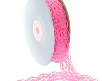 May include: A spool of pink lace trim with a scalloped edge and a floral pattern. The lace is on a white cardboard spool.