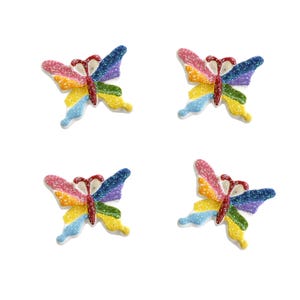 Adornos de resina con parte posterior plana y diseño de mariposas de arcoíris con purpurina (4 piezas)