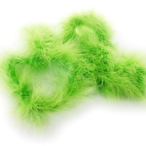 May include: A bunch of bright green feather boas. The boas are soft and fluffy, and they are perfect for adding a touch of fun and whimsy to any outfit.