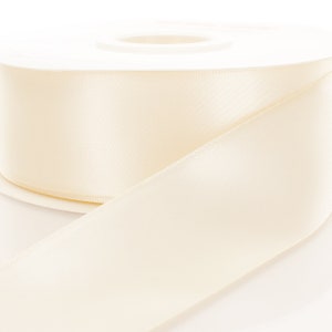 cream ribbon in roll on white Stock Photo