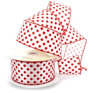 May include: White wired ribbon with red polka dots. The ribbon is rolled up on a spool and is ready to be used for crafting or decorating.