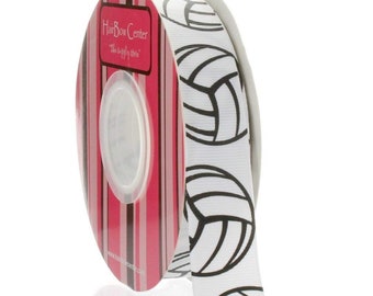 May include: White ribbon with black volleyball designs. The ribbon is rolled up and the label reads "HairBow Center, The Bow-tiful Choice".