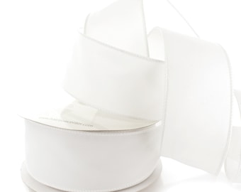 May include: White satin ribbon on a spool. The ribbon is 2.5 inches wide and is perfect for crafting, gift wrapping, and decorating.