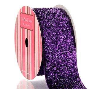 May include: A roll of purple glitter ribbon with a pink and brown striped label that reads "Hair Bow Center - The Simply Chic Store".