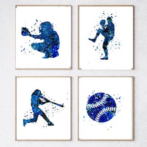 May include: Set of four blue watercolor baseball prints. The prints feature a baseball player catching, a baseball player pitching, a baseball player batting, and a baseball.