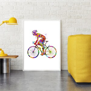 May include: A colorful watercolor painting of a cyclist riding a bicycle. The cyclist is wearing a helmet and the bicycle has two wheels. The painting is on a white background.
