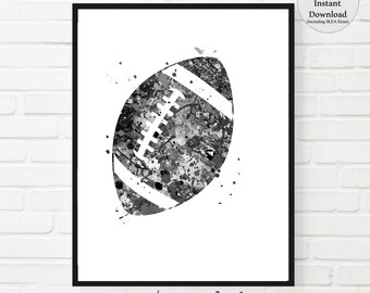May include: Black and white watercolour painting of an American football. The football is surrounded by splashes of paint.