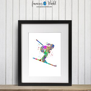 K&ouml;nnte beinhalten: Ein farbenfrohes Aquarellbild einer Person beim Skifahren. Das Bild ist in einem schwarzen Rahmen und auf wei&szlig;em Hintergrund.