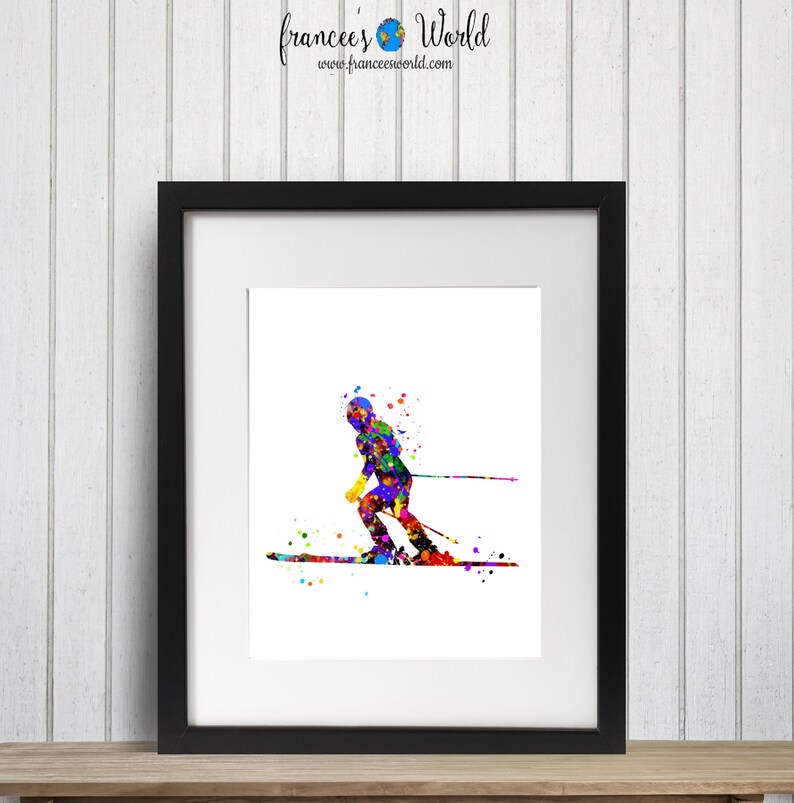 K&ouml;nnte beinhalten: Ein farbenfrohes Aquarellbild eines Skifahrers in Aktion, mit Farbspritzern, die Geschwindigkeit und Bewegung darstellen.