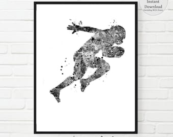 May include: Black and white watercolour painting of a football player running with the ball. The player is in mid-air and the ball is in their hands. The painting is done in a splatter style.