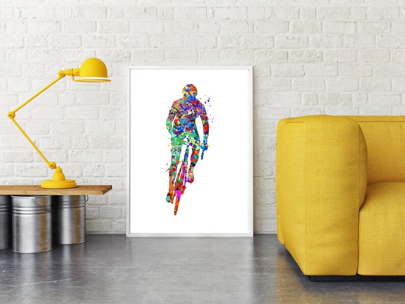 May include: A colorful watercolor painting of a cyclist riding a bicycle. The cyclist is in silhouette and the background is filled with splashes of color.