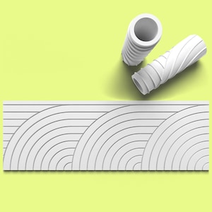 May include: White wall panel with a repeating pattern of concentric circles. The panel is made of a textured material and has a modern design. Two white paint rollers are shown above the panel.