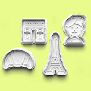 以下が含まれることがあります： クロワッサン、エッフェル塔、凱旋門、ベレー帽をかぶった人の形をした、白いプラスチック製のクッキー型4個セット。