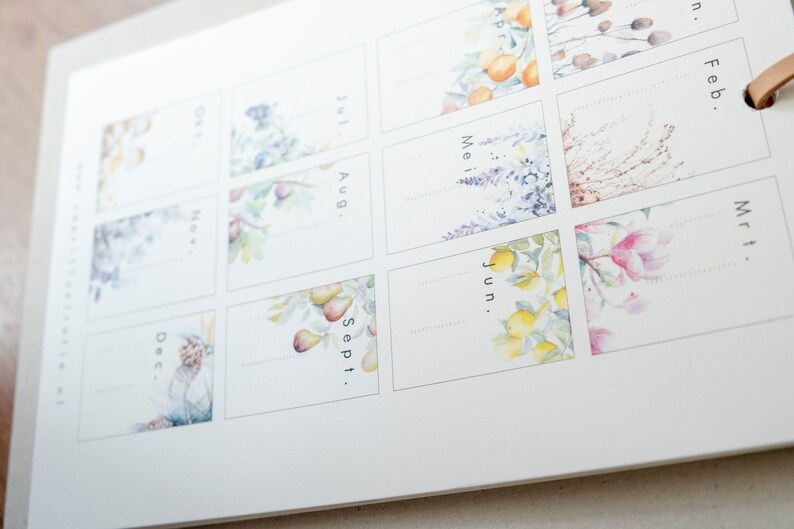 May include: A watercolour calendar with floral illustrations for each month. The months are labelled: January, February, March, April, June, May, July, August, September, and December.