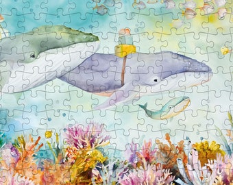 May include: A watercolour painting depicting three whales swimming in the ocean. The whales are grey and blue, and are surrounded by coral reefs and fish. The painting is done in a whimsical style, with bright colours and playful details.