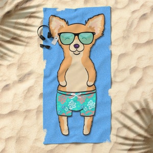May include: A blue beach towel with a cartoon image of a chihuahua wearing sunglasses and floral swim trunks. The chihuahua is lying on its back with its paws in the air.