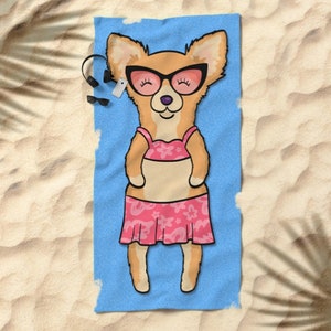 May include: A beach towel with a cartoon illustration of a chihuahua wearing sunglasses and a pink bikini. The chihuahua is lying on its back with its legs in the air. The towel is blue with a white border.