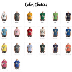 May include: A selection of t-shirt colors with a graphic of a person riding a scooter. The colors include white, asphalt, gold, kelly, leaf, navy, ocean blue, pink, red, soft cream, steel blue, true royal, yellow, deep heather, heather blue, heather forest, heather midnight navy, heather orange, heather raspberry, and heather true royal.