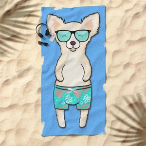 May include: A white chihuahua wearing sunglasses and blue and green floral swim trunks on a blue beach towel.