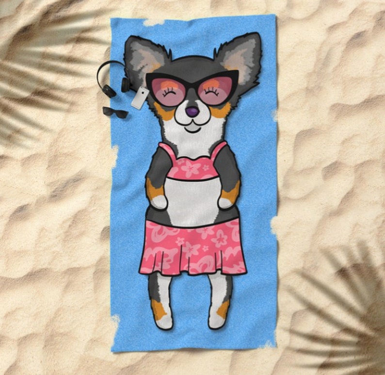 May include: A cartoon illustration of a dog wearing sunglasses and a pink bikini on a blue beach towel.