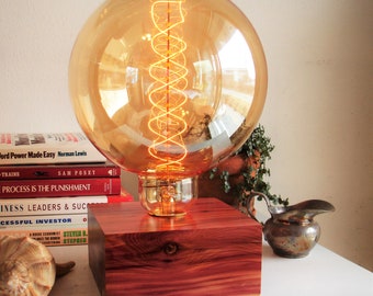 12x6dia 90a   Large cedar table lamp with all sorts of moves featuring an in-line DIMMER switch and a large Edison old world globe bulb.