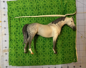 Protective pony pouch for classic scale Breyer model horse.