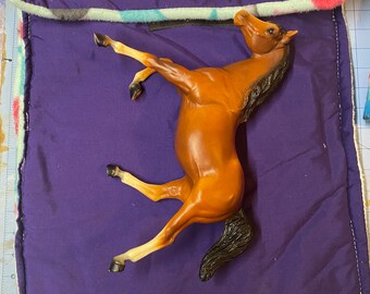 Protective pony pouch for large traditional scale Breyer model horse.