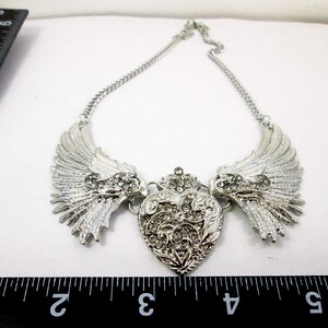 large angel wings with heart bib necklace with measurement indicator