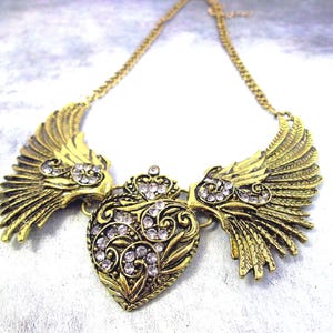 large angel wings with heart bib necklace, antique gold color